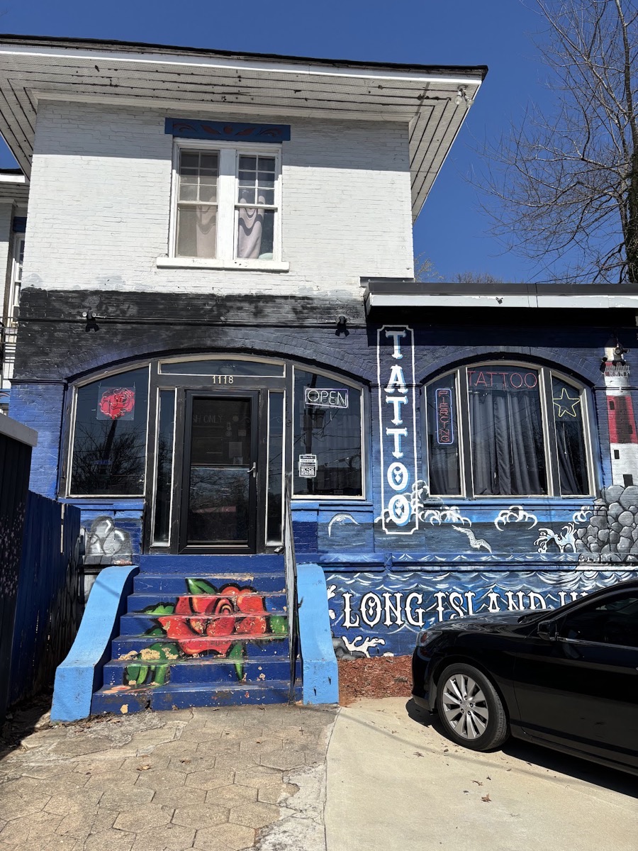 Long Island Ink's hand-painted blue storefront on Euclid Ave in Little Five Points, Atlanta